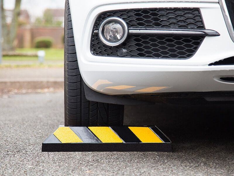 black and yellow chevron parking block